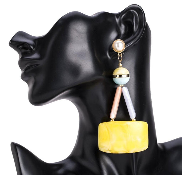 Long yellow plastic dangle earrings