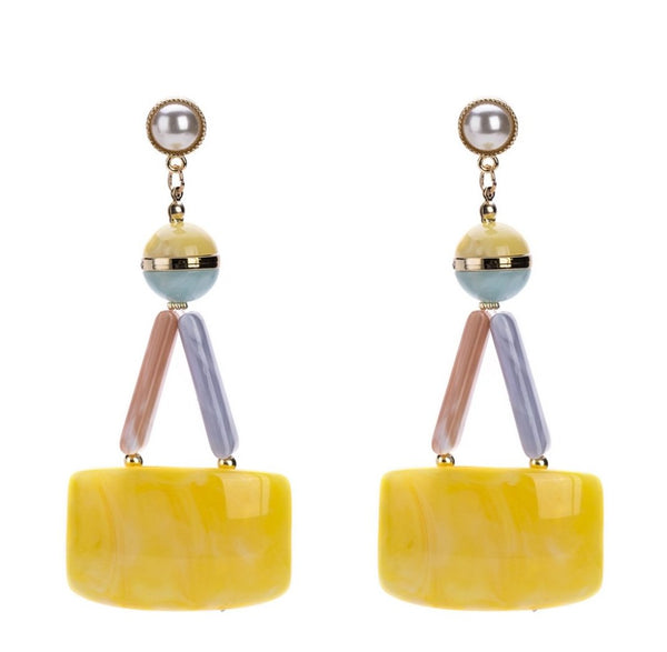 Long yellow plastic dangle earrings