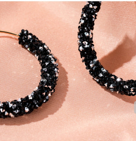 Hoop earrings with rhinestones